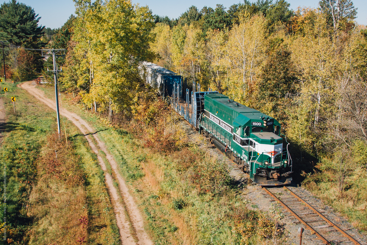 Wisconsin Northern GP-15 number 1500 hauls cars from Bell Pole and the Jennie-O Turkey Store east from Barron to Cameron. Here at Cameron, the train will take the Chippewa Falls Sub south to their yard in Norma.