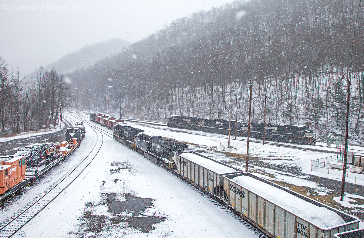 On a blistery winter day, two ES44AC’s lug a cut of 60 loads off the Guyandotte River Branch and onto the P-D mainline at Elmore. The two engines pictured are the pushers and the headend power will soon couple up after they get the train onto the main. Blizzard like conditions will make the the journey the Clark’s Gap very slow and treacherous. 