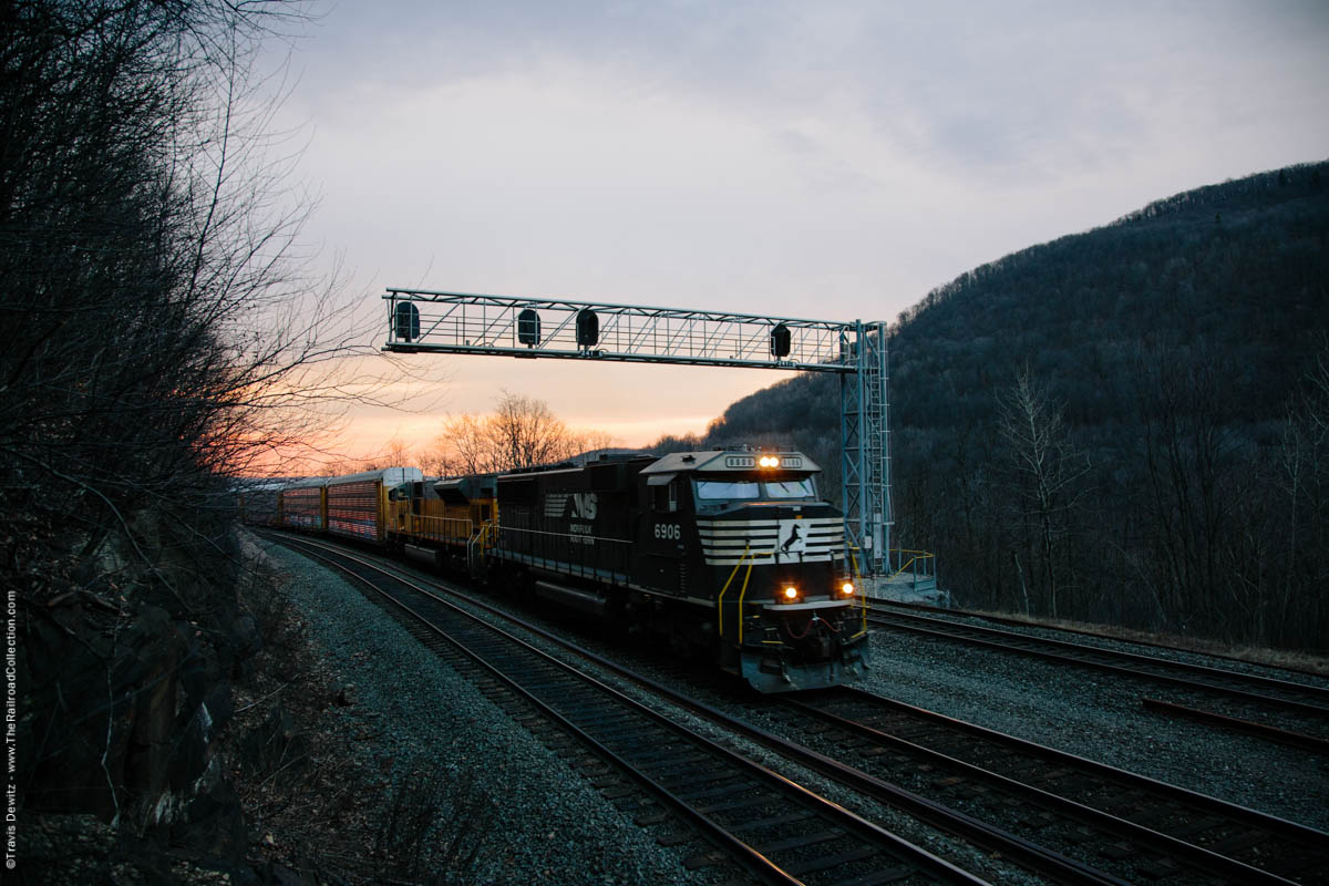 Norfolk Southern autorack train grinds around Horseshoe Curve on this beautiful late winter morning near Altoona, Pennsylvania.